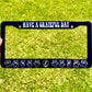 An engraved aluminum license plate frame with 'Grateful Dead' text and bear logos, held up against a grassy background.