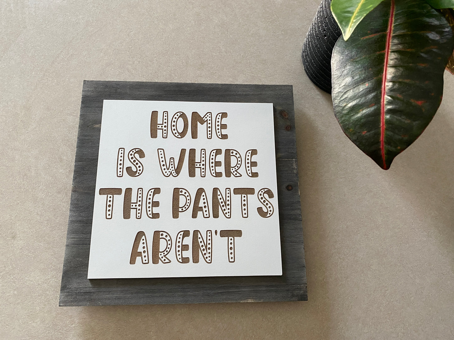 Home Is Where The Pants Aren’t Sign